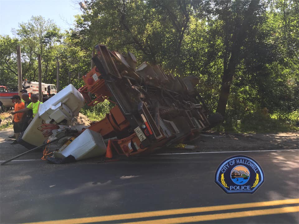 Driver charged after bucket truck rollover crash in Hallowell