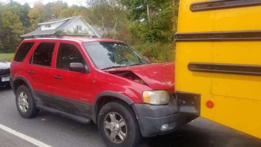 Driver in crash involving school bus charged with OUI