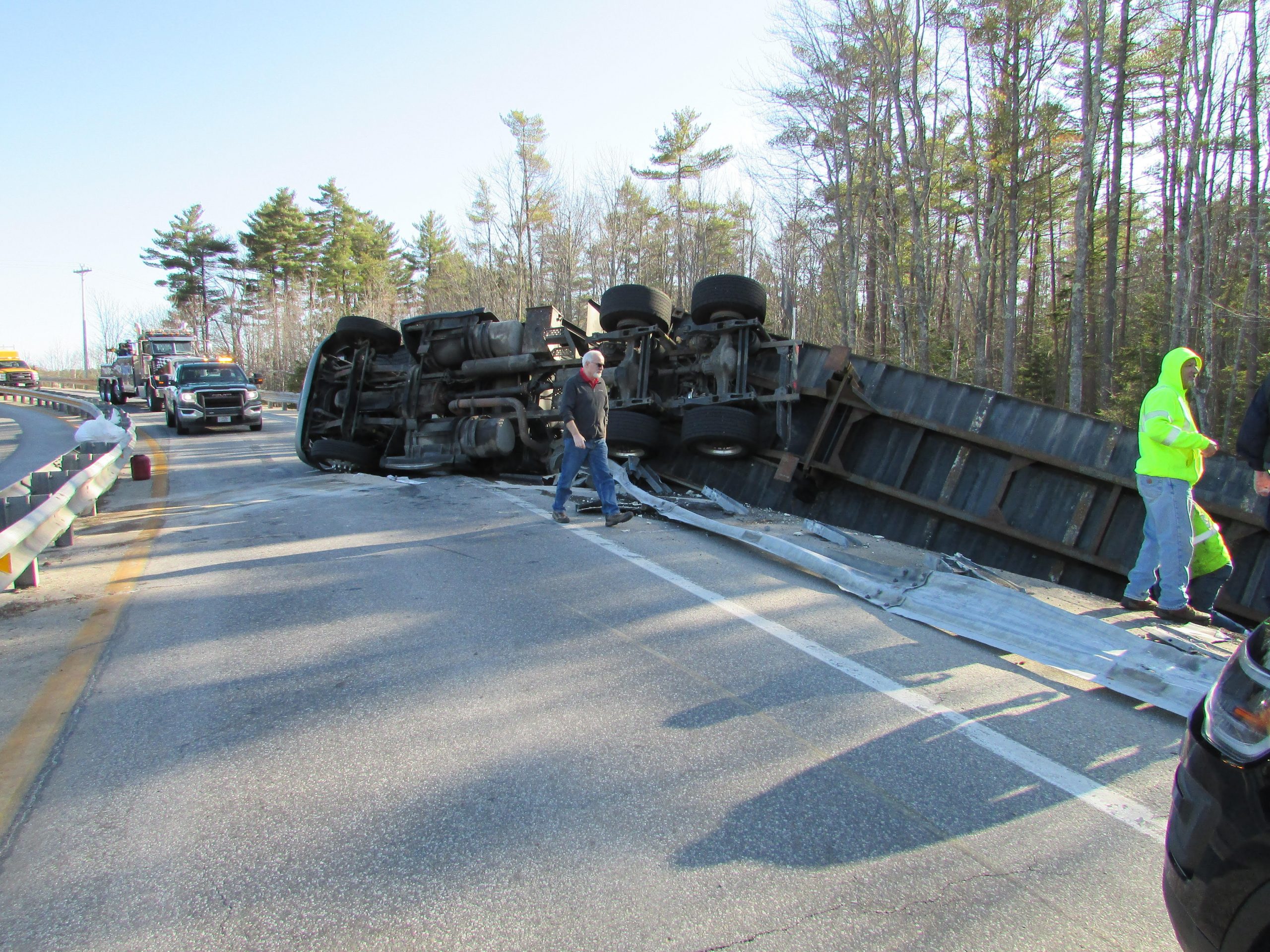 Tractor-trailer hauling french fries overturns; driver suffers minor injuries