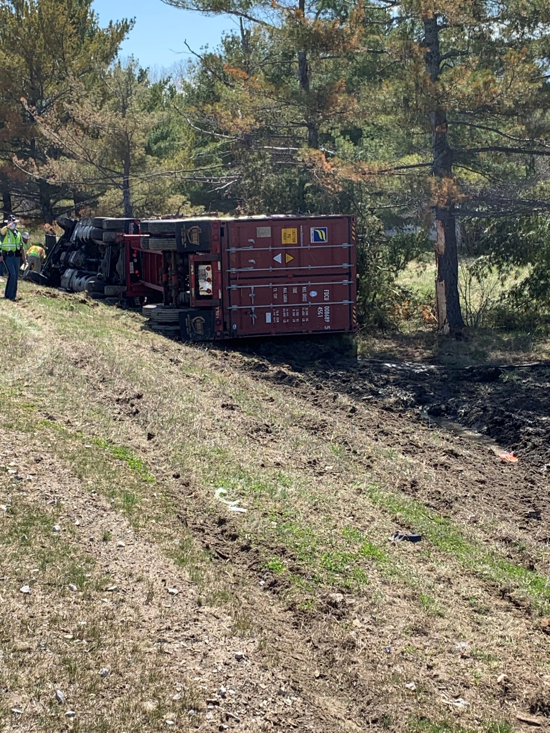 Tractor trailer hauling lumber overturns in Portland
