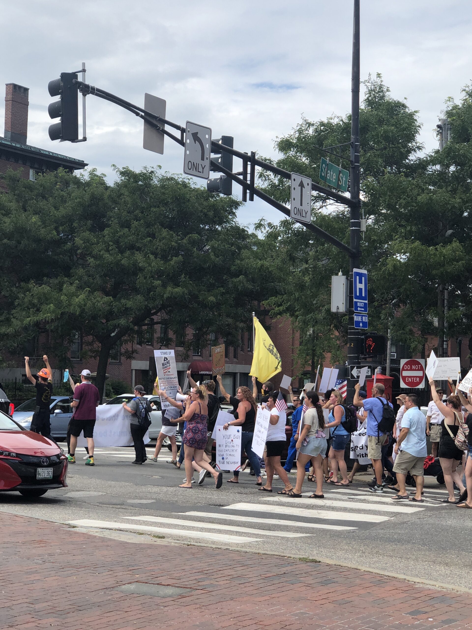 Health care workers and other supporters protest vaccine mandate in Portland