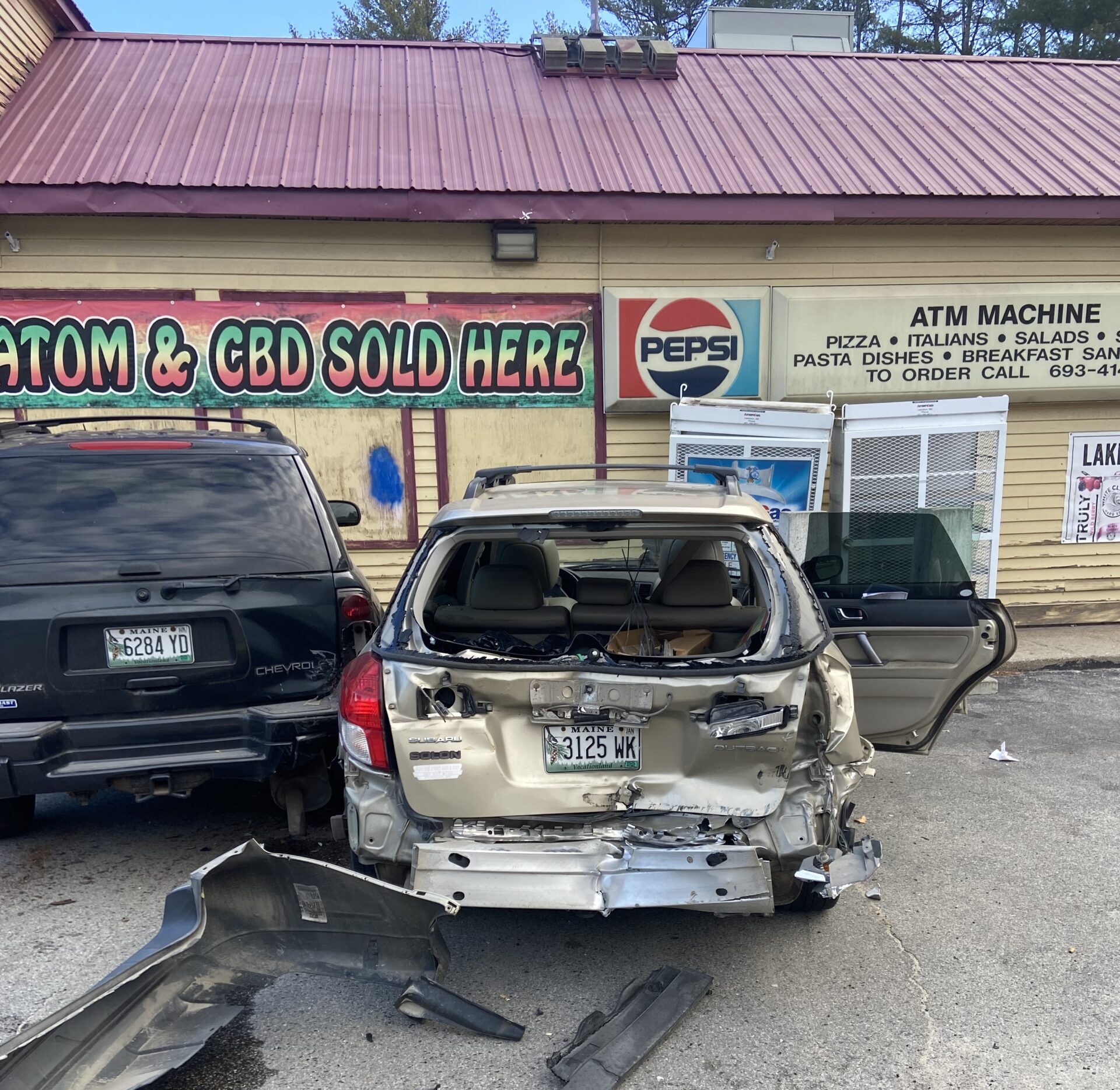 Crash involving school bus causes damage to Naples convenience store