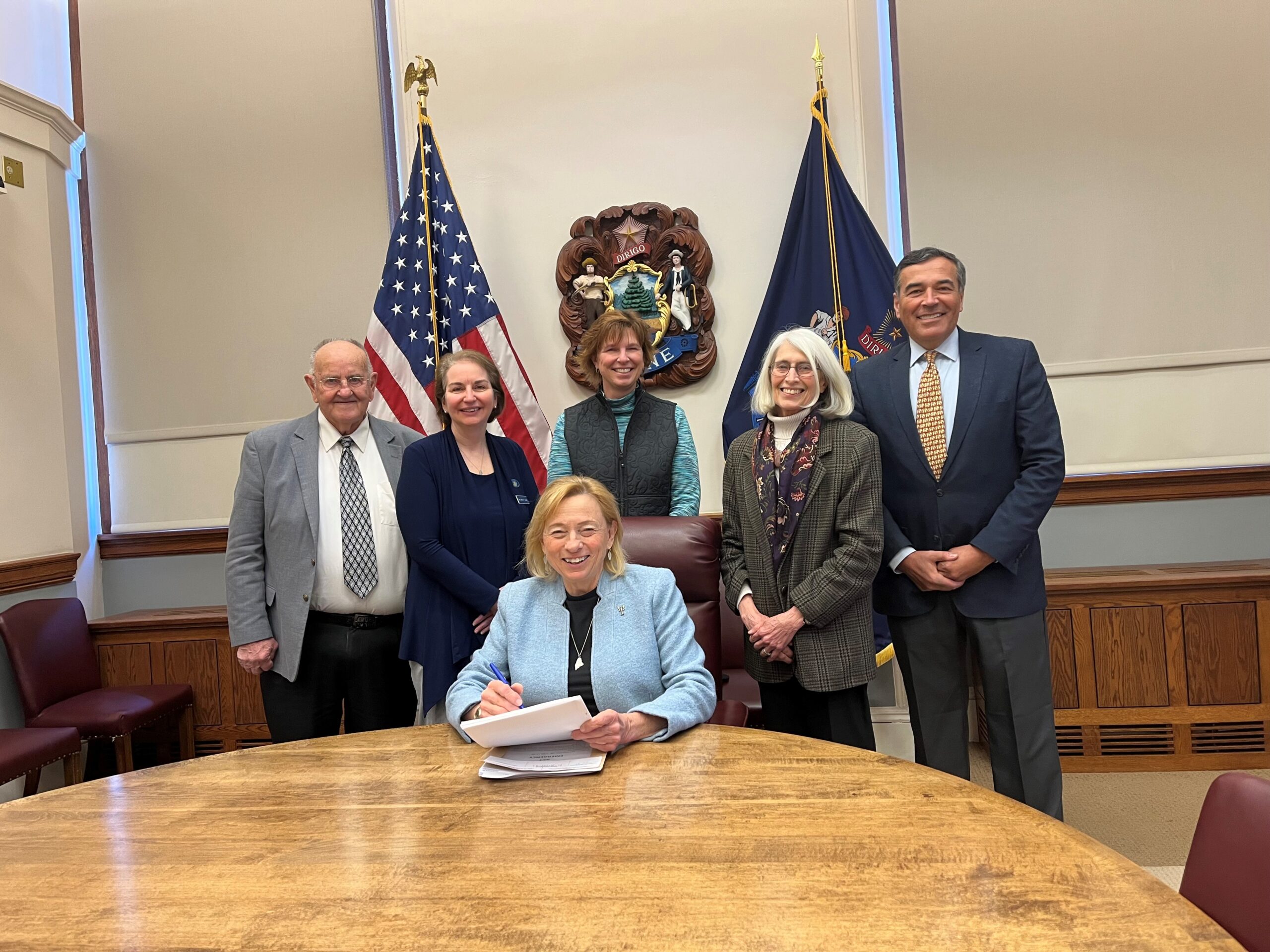 Governor touts bipartisanship in signing budget adjustment