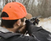 Man aiming shotgun