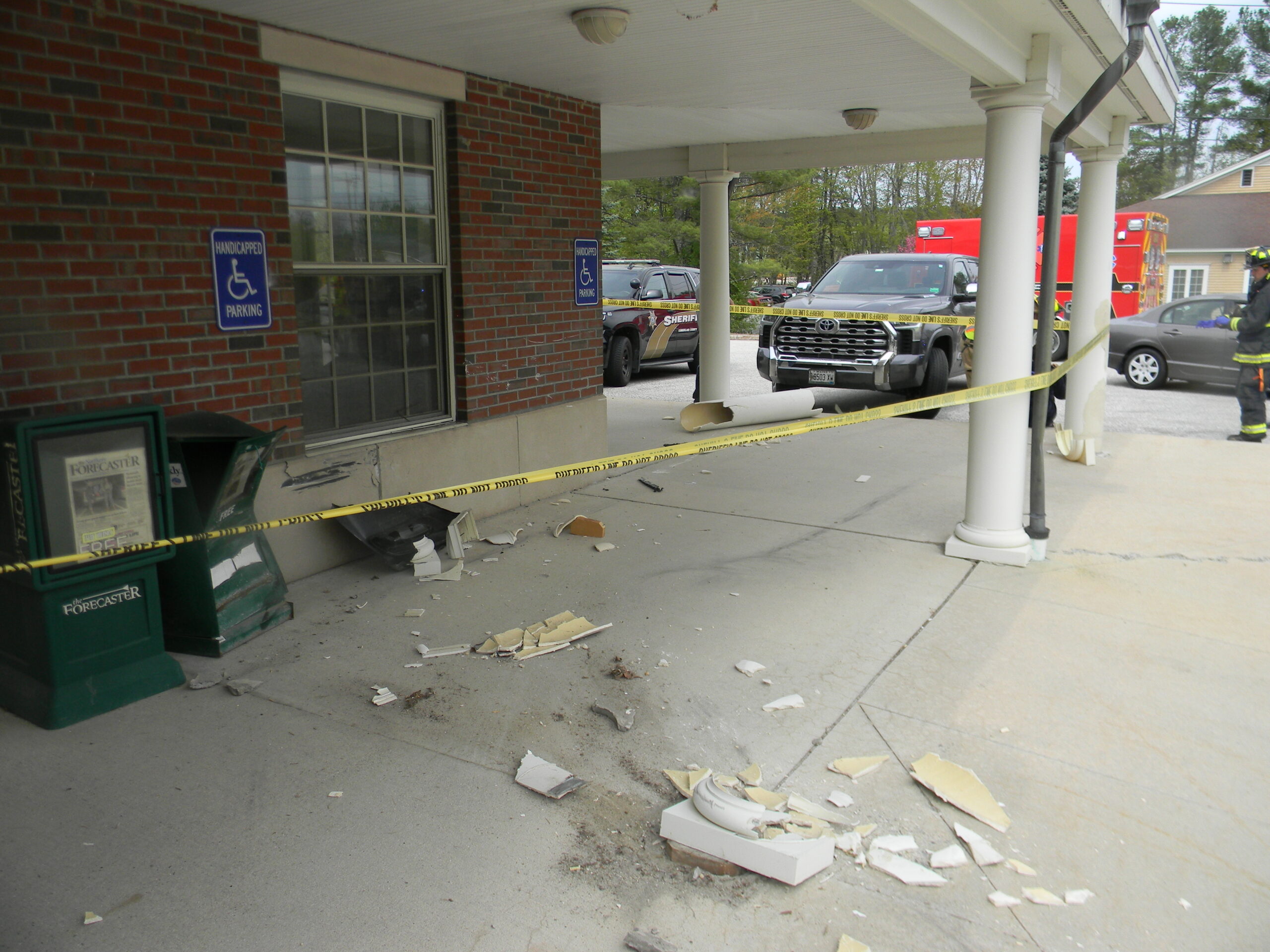 Crash in Gray causes damage to Post Office and parked vehicle