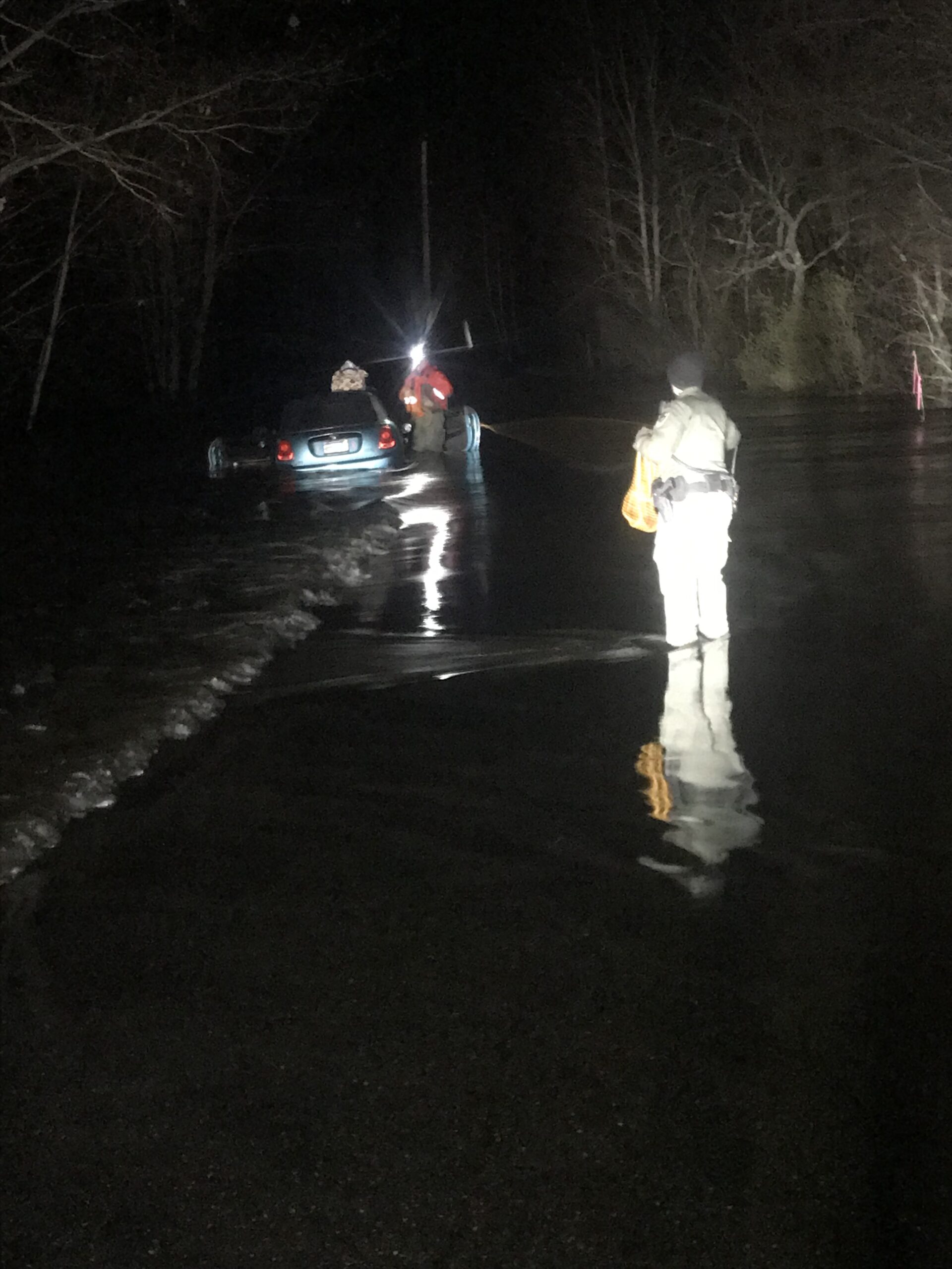 Warden rescues Florida woman trapped in vehicle on flooded road in Waterboro