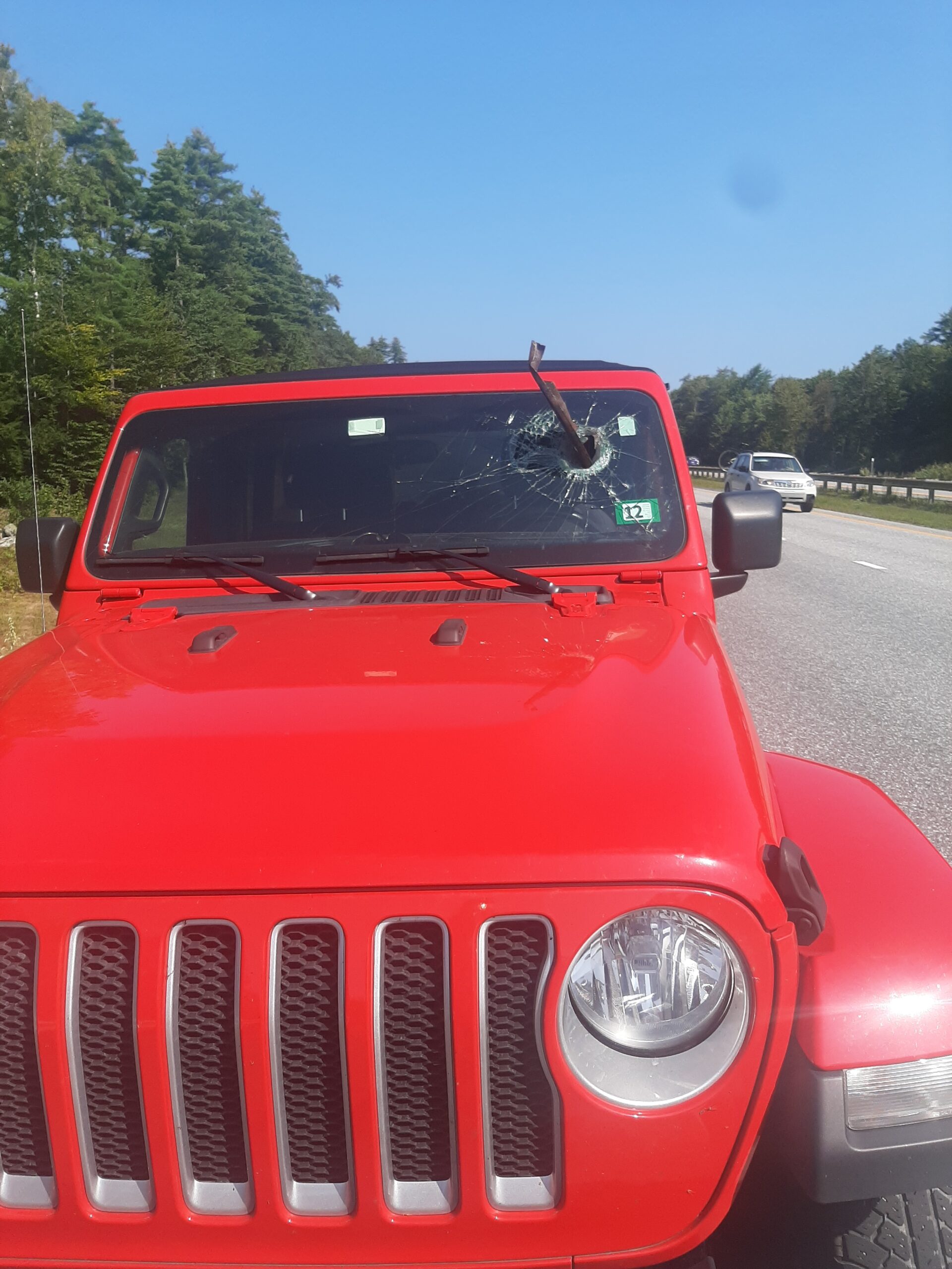 Woman Escapes Serious Injury After Metal Debris Impales Jeep Wrangler Windshield