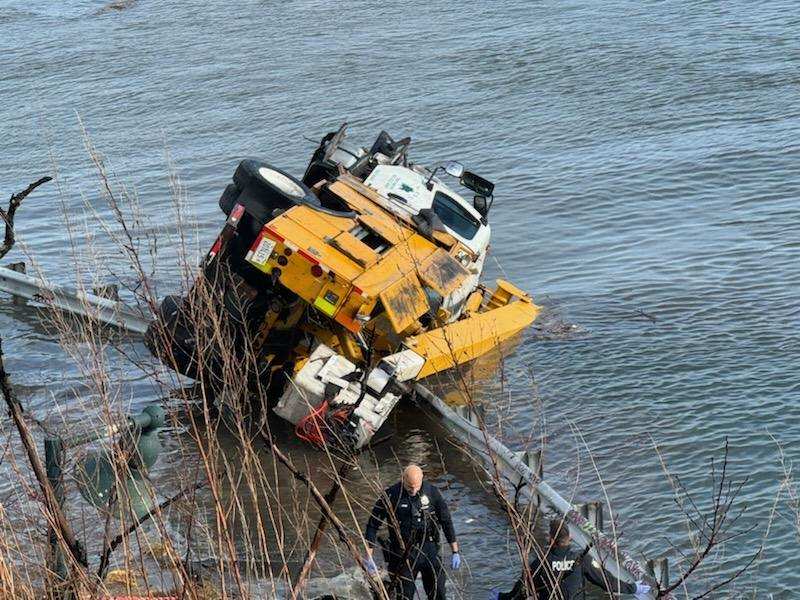 Three people treated for minor injuries after utility truck goes off Portland bridge