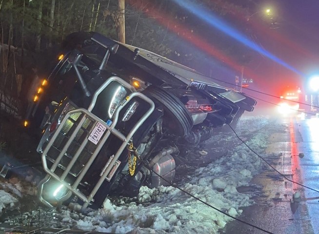 Route 302 in Napes closes after tractor-trailer tips onto its side