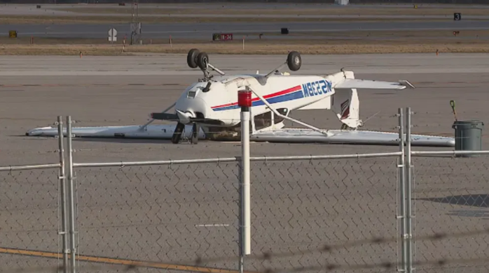 Small, unoccupied plane flipped upside down by wind gust at Portland Jetport