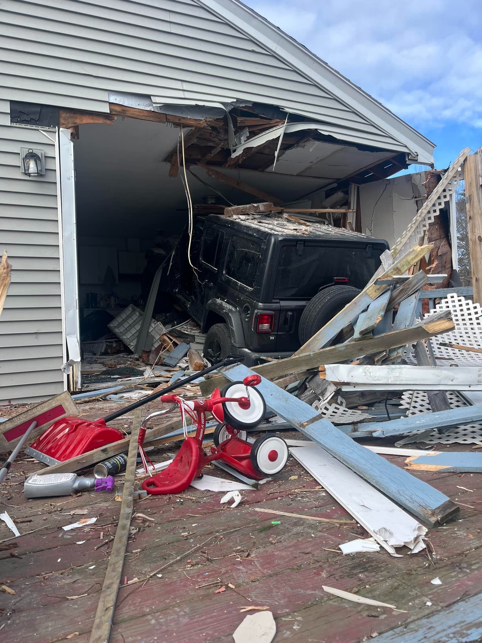 Road closed as crews removed vehicle that crashed through Westbrook home