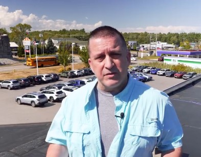 Man on Roof at Saco Car Dealer Raising Money for STRIVE