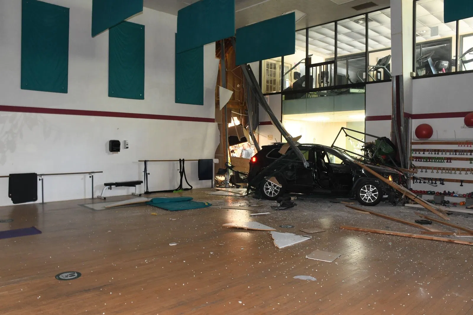 2 injured after vehicle crashes through fitness center in Brunswick