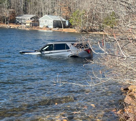 Driver Not Injured After SUV Ends Up in Acton Pond