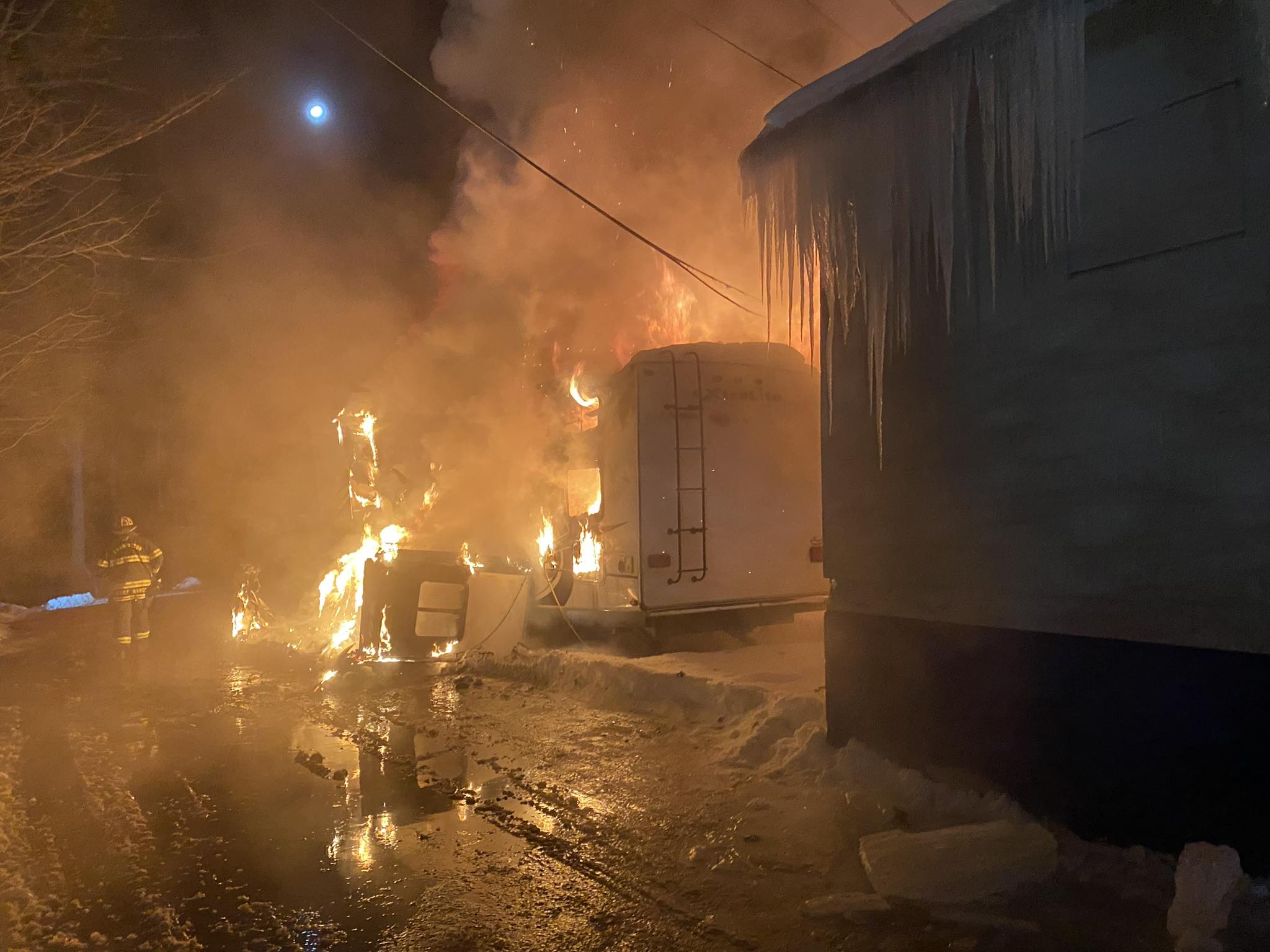 Fire Destroys Camper, Threatens Auto Dealership in Farmington Fire Destroys Camper, Threatens Auto Dealership in Farmington