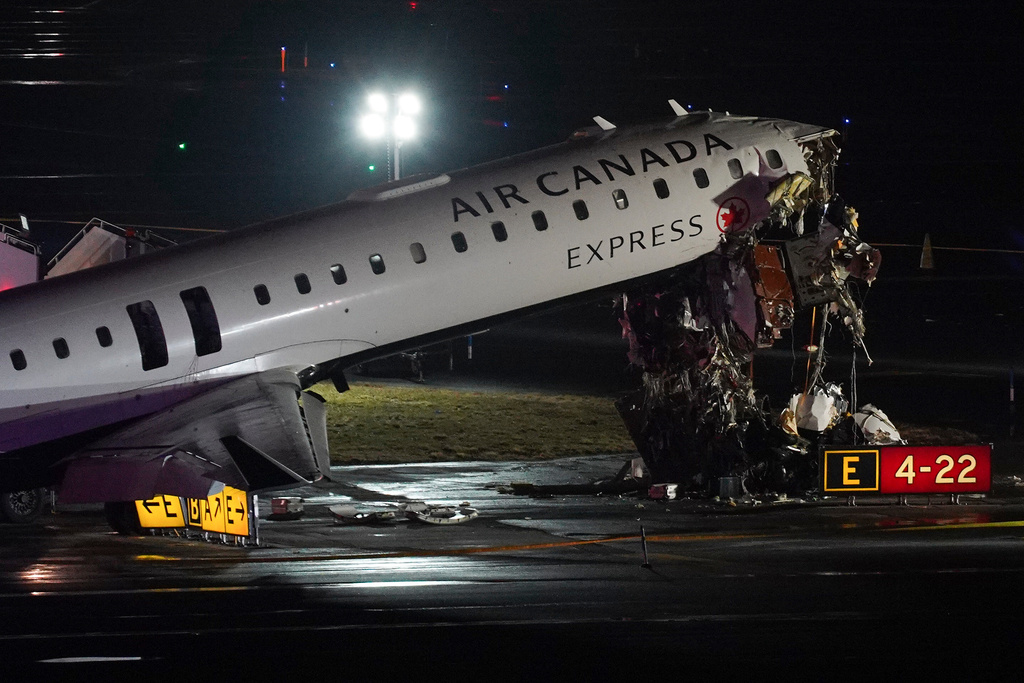 Pilot and copilot killed in collision between jet and fire truck at New York’s LaGuardia Airport